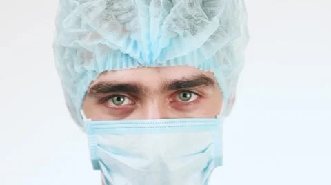 A Young Doctor Looking at The Camera. It is Very serious. Doctor wearing a Stock Footage 58627572