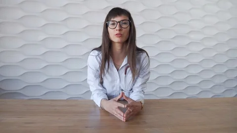 Young doctor looking at the camera talking with veivers. Online Doctor Stock Footage 114081016