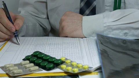 Young doctor makes the log entry Stock Footage 87036385