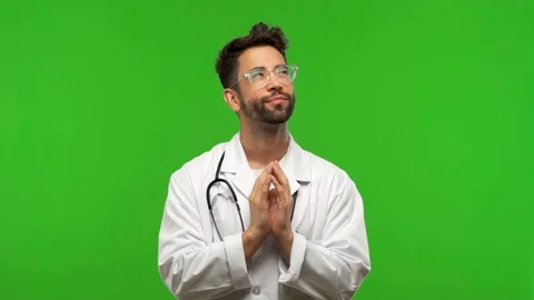 Young doctor man on chroma devising a plan Stock Footage 97706840