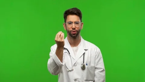 Young doctor man on chroma doing a typical italian gesture Stock Footage 97706871
