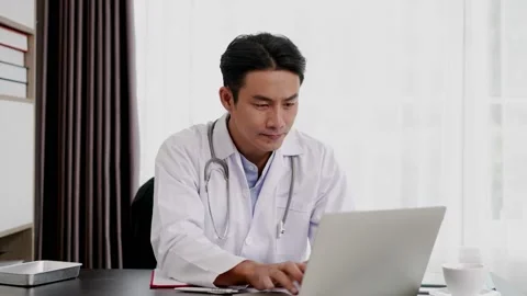 Young Doctor use laptop computer researching  about medical Stock Footage 152497550