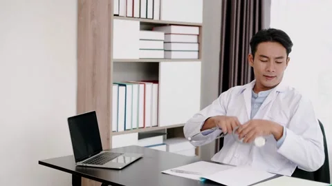 Young Doctor use laptop computer researching  about medical Stock Footage 153068840