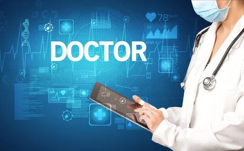 Young doctor writing down notes Stock Photos