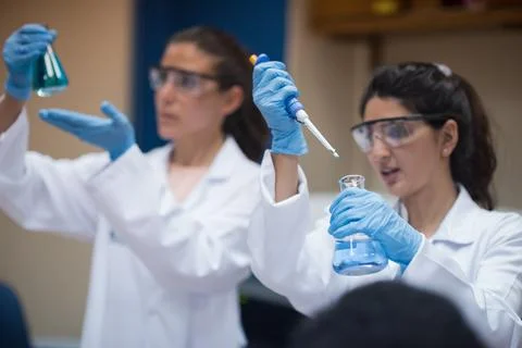 Young doctors and lab technicians performing blood testing in a clinical 스톡 사진