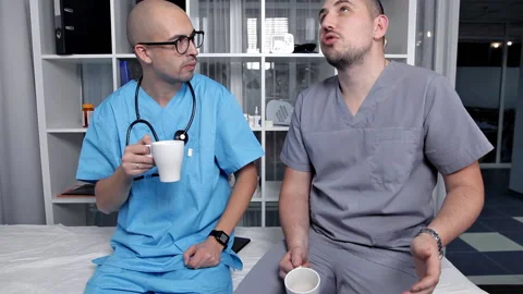 Young Doctors Speak at Coffee Break Stock Footage 101211539