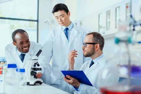 Young doctors in uniform working at testing laboratory, laboratory technician Stock-Fotos