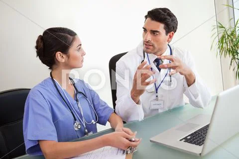 Young doctors working with a laptop Stock Photos