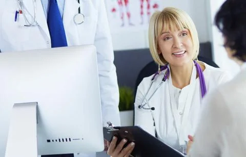 Young doctors working with a notebook in an office Stock Photos