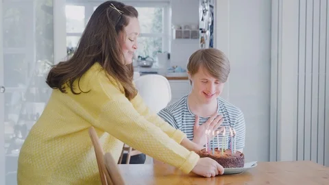 Young Downs Syndrome Couple Celebrating Birthday At Home With Cake Stock Footage