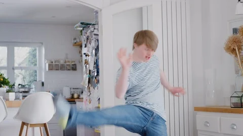 Young Downs Syndrome Man Having Fun Dancing At Home Stock Footage 114306167