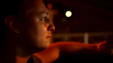 Young driver driving at night Stock Footage 135924768