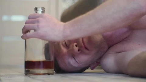 A young drunk man sleeps on the floor. Stock Footage 100626594