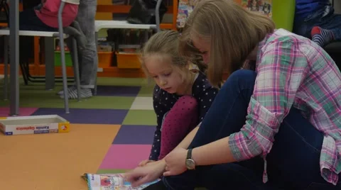 Young Educator Mom Kid Reading Children's Day Library in Opole Poland Parents Stock Footage 61210722