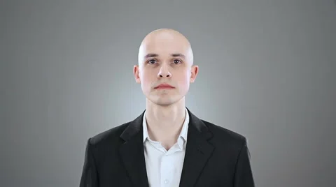 Young elegant bald man is acting behaviour isolated on white 動画素材 64477207