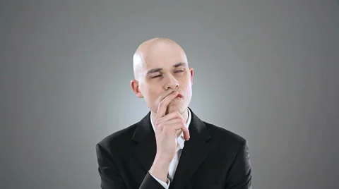 Young elegant bald man reach a successful conclusion isolated on white 動画素材 64477464