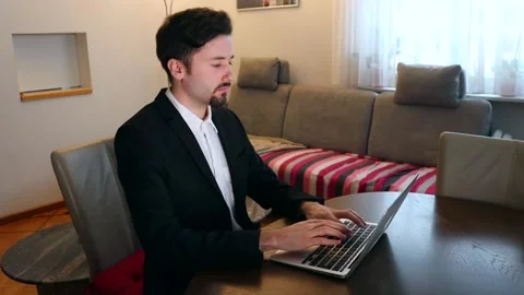 Young Elegant Businessman working on computer Stock Footage 146889423