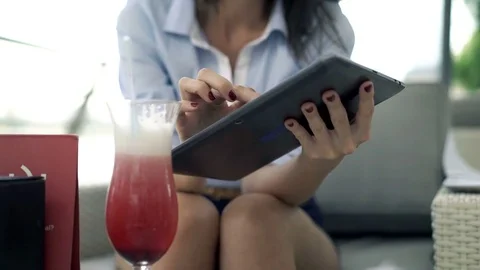 Young, elegant woman using tablet while sitting in cafe in city, focus on hands, 스톡 동영상 72087758