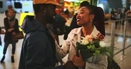 Young Emotional Couple Embracing At Airport After Flight Arrival Stock Footage