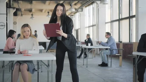 Young employee communicate with colleagues and discuss business processes Stock Footage 108939965