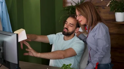 Young employee explaining his ideas to new brand manager Stock Footage 113915956