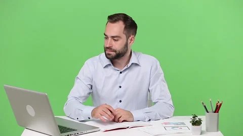 Young employee man sit work with documents desk pc laptop computer chatting Stock Footage 136284749