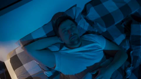 Young employee man with sleep problems and insomnia symptoms. Sleepless man all Stock Footage 145439728