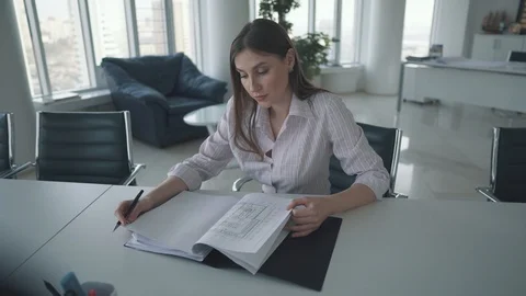 Young employee working at the table in the office. attractive business woman Stock Footage 105394830