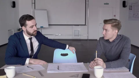 Young employees are working at table in modern office indoors. Stock-Footage 85628690