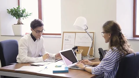 Young employees is working and talking in leading company. Stock Footage 81848289