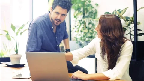 Young employees working together in a bright office. Stock Footage 117491567