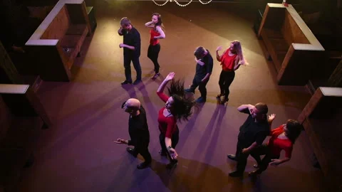 Young energetic attractive couples dancing salsa, bachata, latin dance on open Stock Footage 98565360