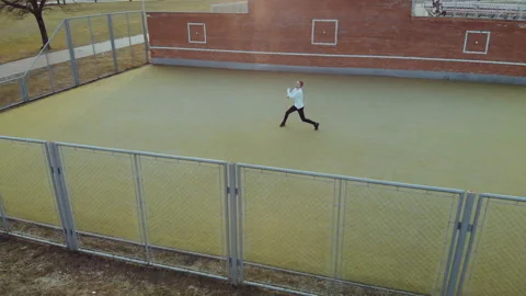Young energetic guy, a street dancer in black pants and a white sweater Stock Footage 108614607