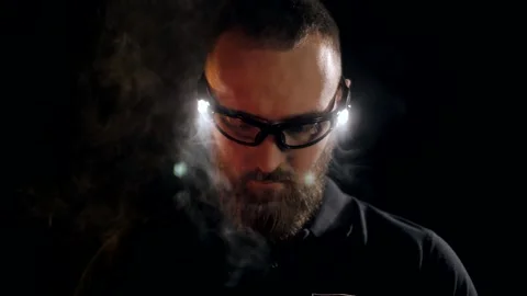 Young engineer with beard in protective goggles with backlight Stock Footage 151646233