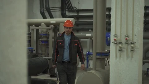 A young engineer becomes ill at work is in a technical room. at the factory Stock Footage 105607190