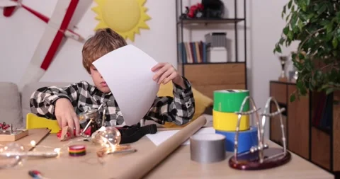 Young engineer. Boy passionate about electronics. DIY kid. Inventions and Stock Footage 171863939