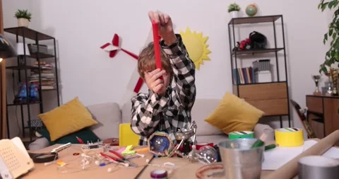 Young engineer. Boy passionate about electronics. DIY kid. Inventions and Stock Footage 171864758