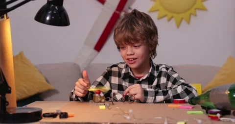 Young engineer. Boy passionate about electronics. DIY kid. Inventions and Stock-Footage 171865002