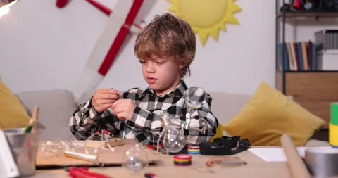 Young engineer. Boy passionate about electronics. DIY kid. Inventions and Stock Footage 172162339