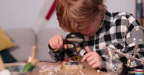 Young engineer. Boy passionate about electronics. DIY kid. Inventions and Stock Footage 172162600