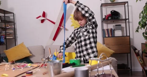 Young engineer. Boy passionate about electronics. DIY kid. Inventions and Stock Footage 172163311