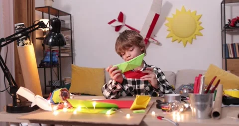 Young engineer. Boy passionate about electronics. DIY kid. Inventions and Stock Footage 172164092