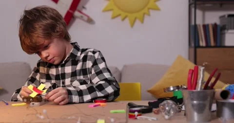 Young engineer. Boy passionate about electronics. DIY kid. Inventions and Stock Footage 172566427