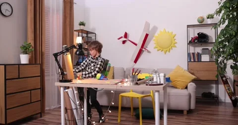 Young engineer. Boy passionate about electronics. DIY kid. Inventions and Stock Footage 222923248