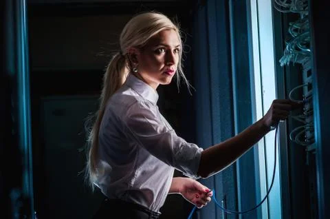 Young engineer businesswoman in server room Stock Photos