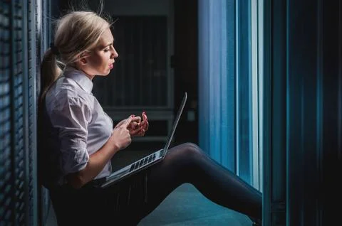 Young engineer businesswoman in server room Stock Photos
