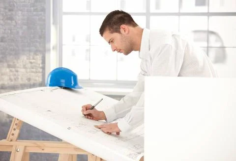 Young engineer busy by working Young engineer busy by working, using drawi... 写真素材