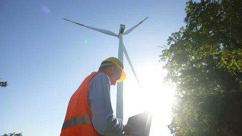 An young engineer is checking with laptop a correct operation and efficiency Video stock 141372426