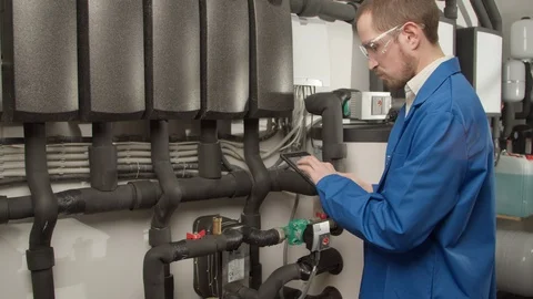 Young engineer checking new equipment Stock Footage 127171722