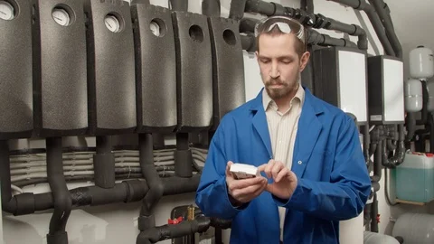 Young engineer checking new equipment Stock Footage 127173134